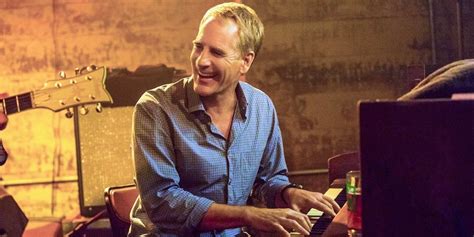 scott bakula playing the piano.